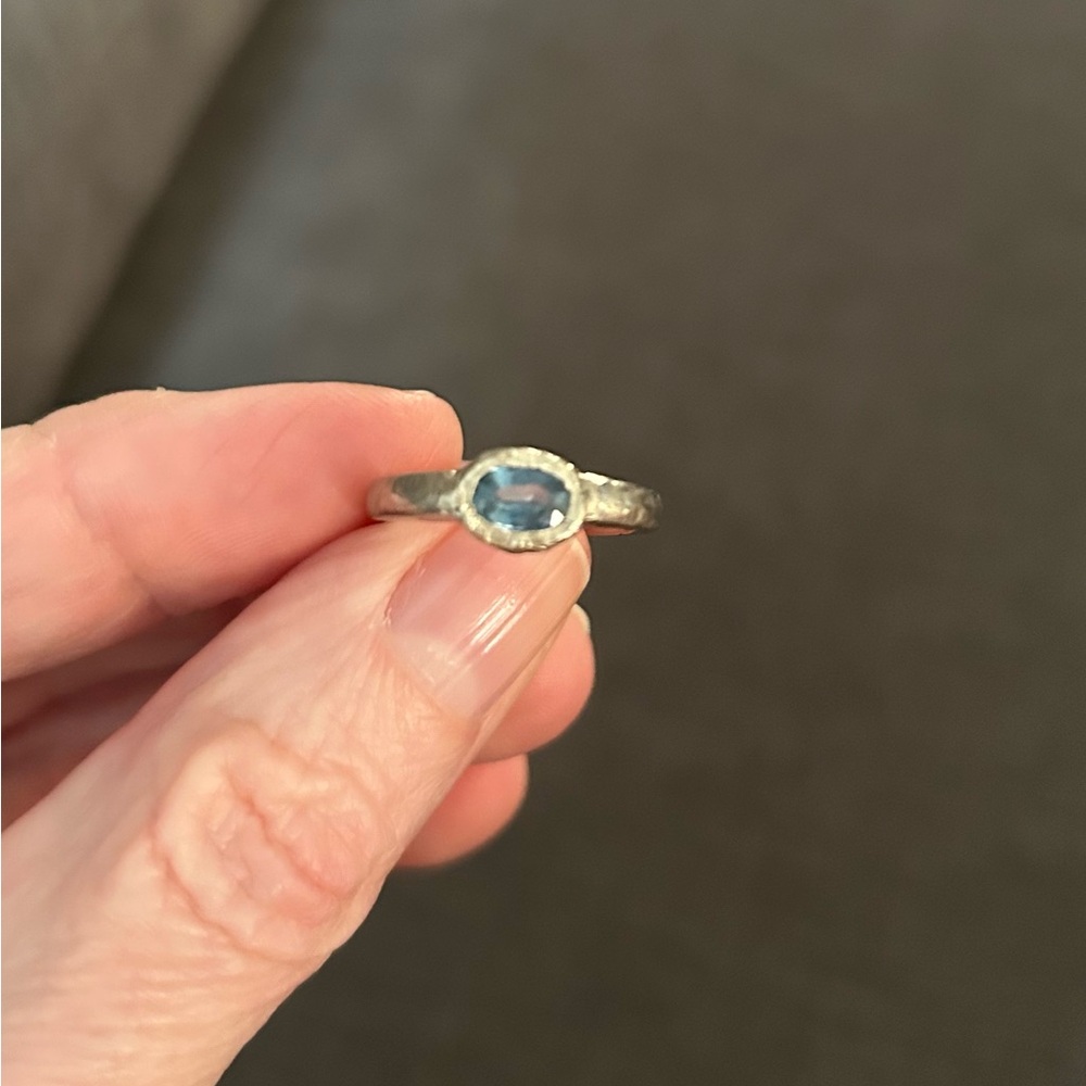 Elegant Light Blue Oval Sapphire in White Gold Hammered Setting